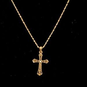Gold tone necklace with cross